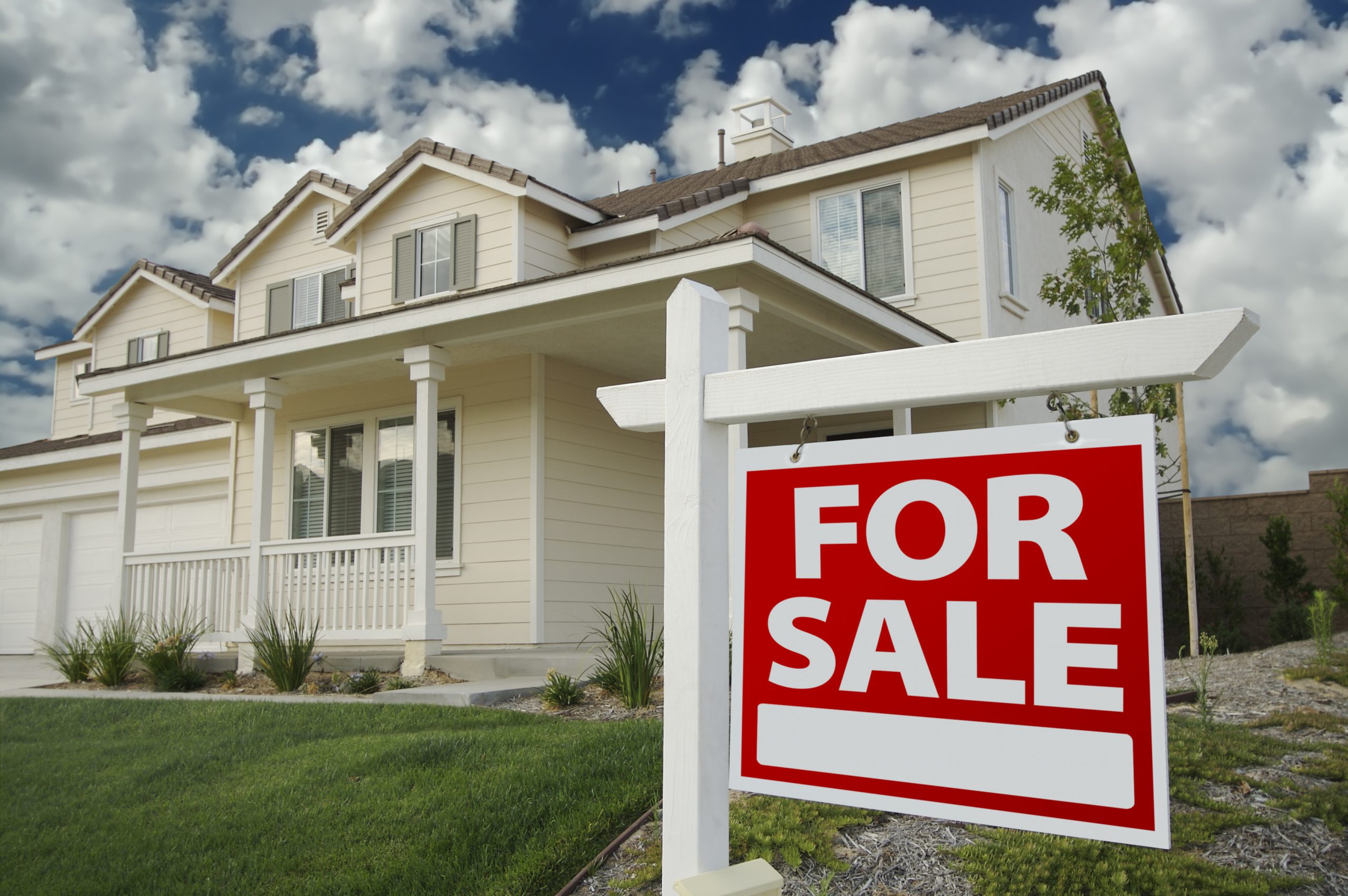 Home For Sale Sign in Front of Beautiful New Home