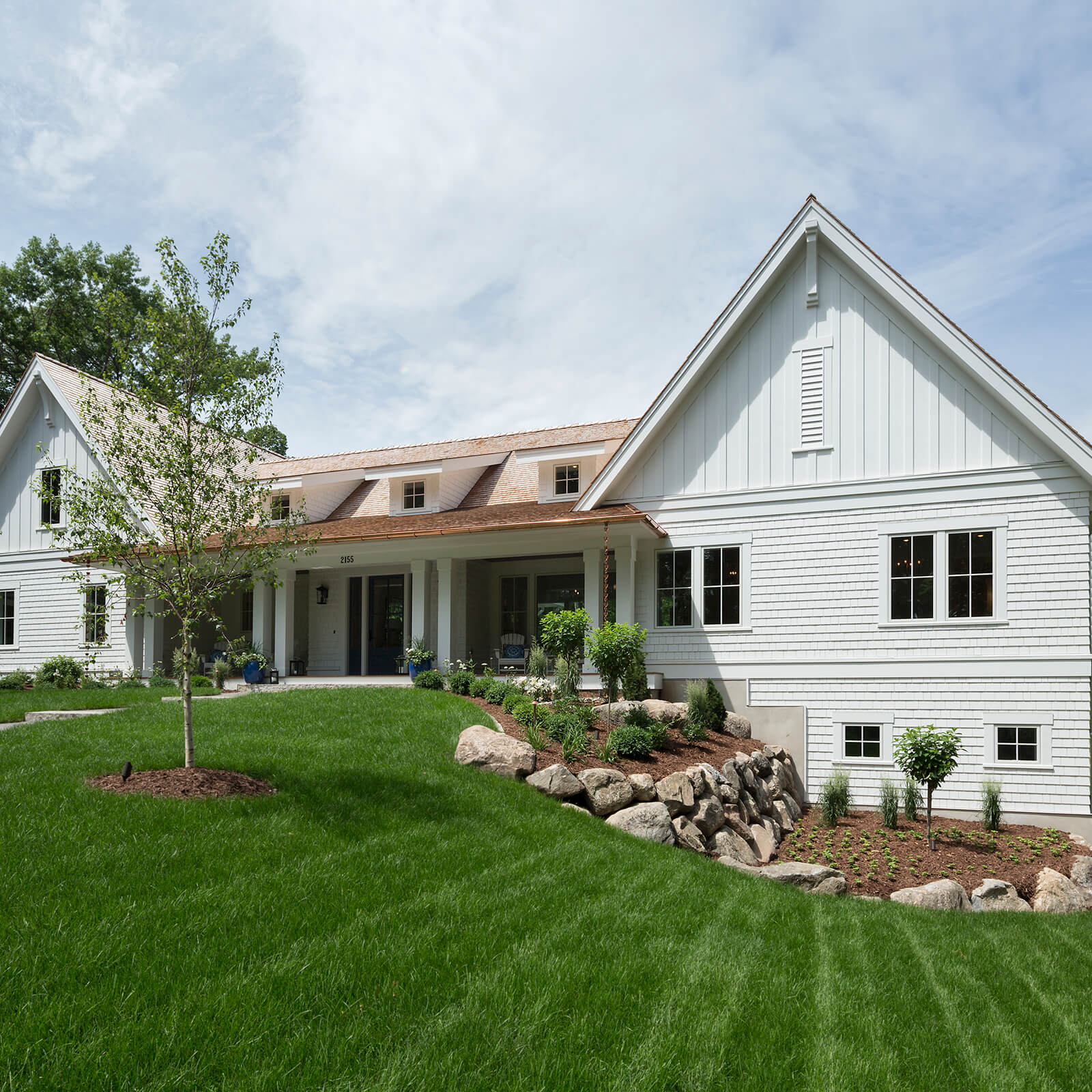 A beautiful house with siding and replacement windows from Precision Siding & Windows in Kansas City Missouri