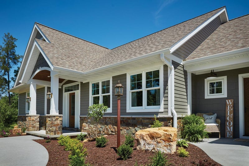 A beautiful house with siding and replacement windows from Precision Siding & Windows in Kansas City Missouri